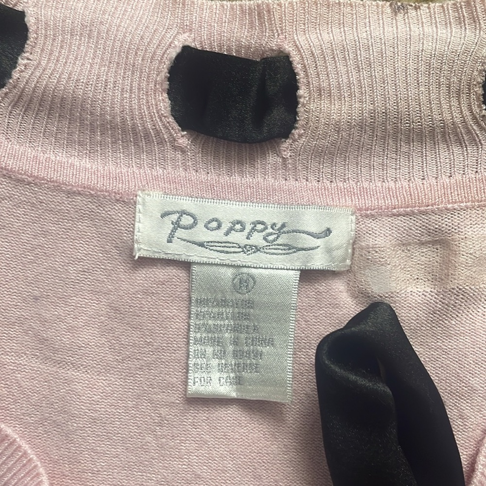 Pink sweater with black tie along neckline - Picture 3 of 11